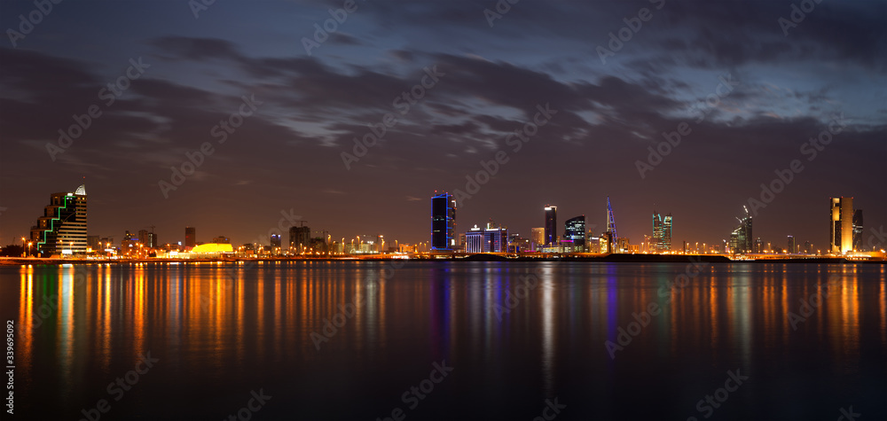 Panormic view of Bahrain skyline with reflection at twilight