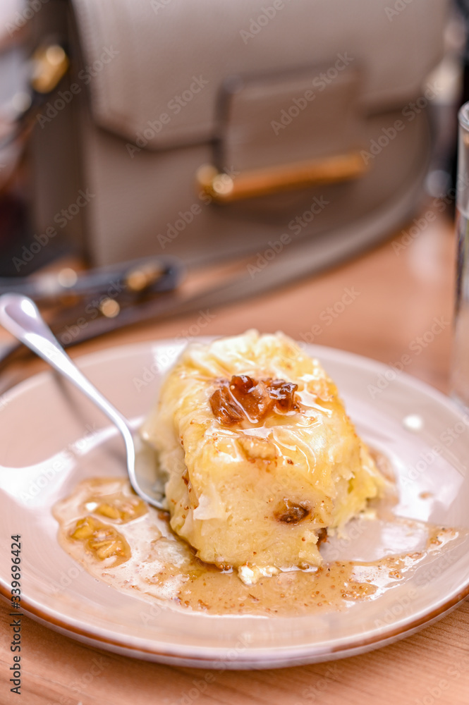 Traditional Slovenian dessert made of dough, cheese and fruit. Dumplings with nuts and figs for a delicious breakfast in a European cafe Traditional Slovenian dessert made of dough, cheese and fruit. Dumplings with nuts and figs for a delicious breakfast in a European cafe