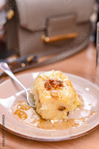 Traditional Slovenian dessert made of dough, cheese and fruit. Dumplings with nuts and figs for a delicious breakfast in a European cafe