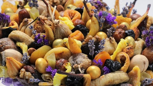 Box filled with different dried fruits as a gift, circular motion