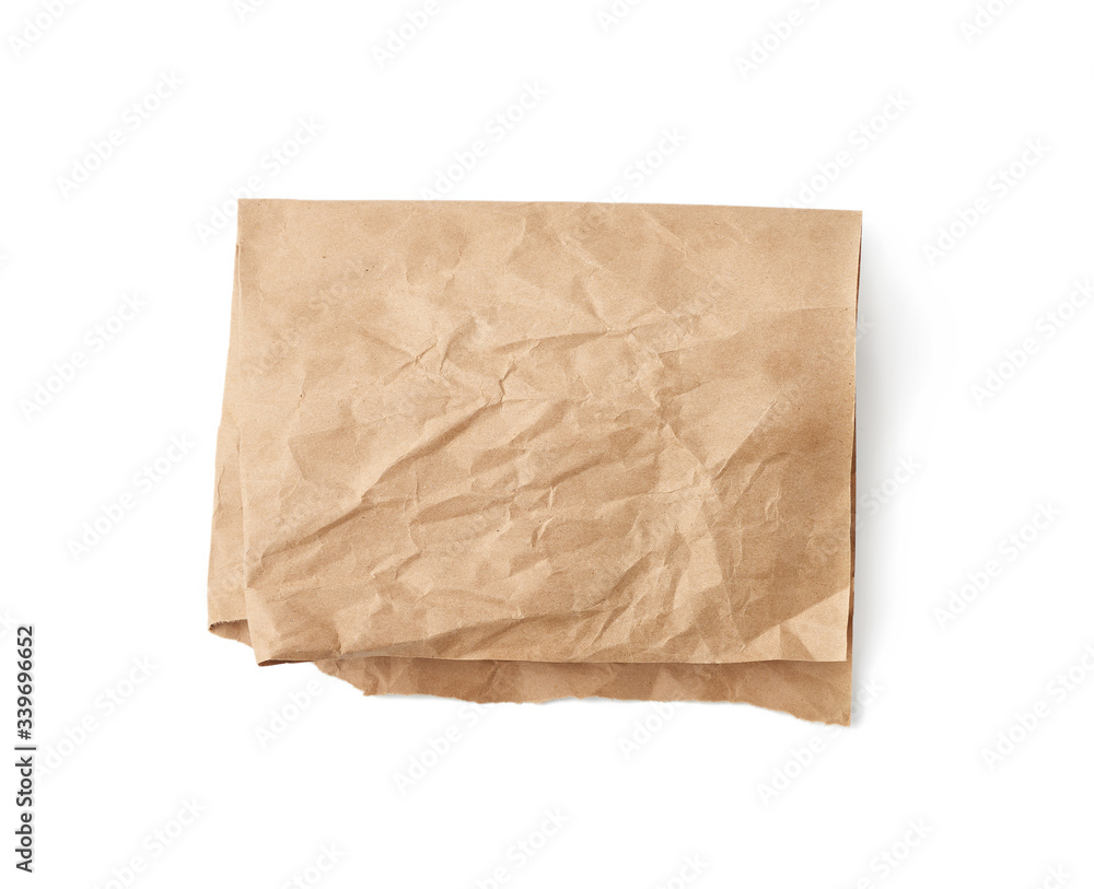 folded sheet of brown crumpled paper isolated on white background