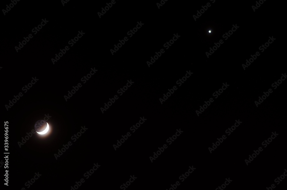 The growing moon and star photo of the night sky The growing moon and star photo of the night sky