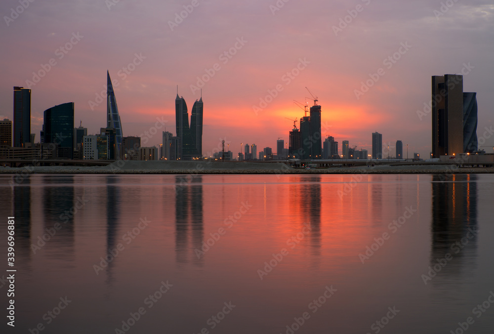 Dramatic colours of Bahrain skyline at sunset.