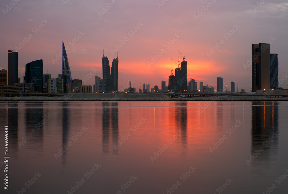Dramatic colours of Bahrain skyline at sunset. Dramatic colours of Bahrain skyline at sunset.