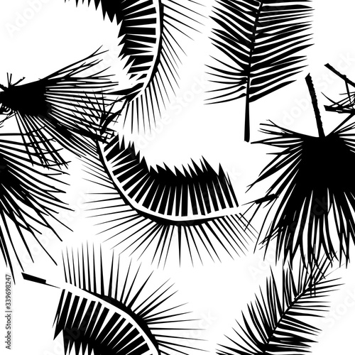 A seamless background of palm leaves. Vector illustration