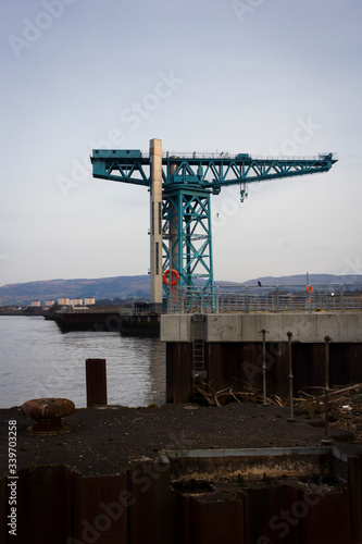 A Crane by the river Clyde near Glasgow in the west of Scotland on a cold winter morning.  photo