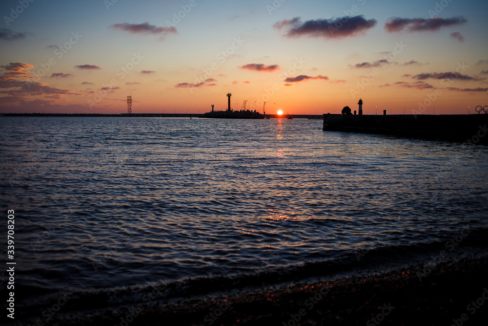 Seashore during bright sundown. Composition of the nature.