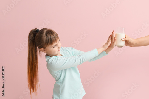 Little girl with milk aller...