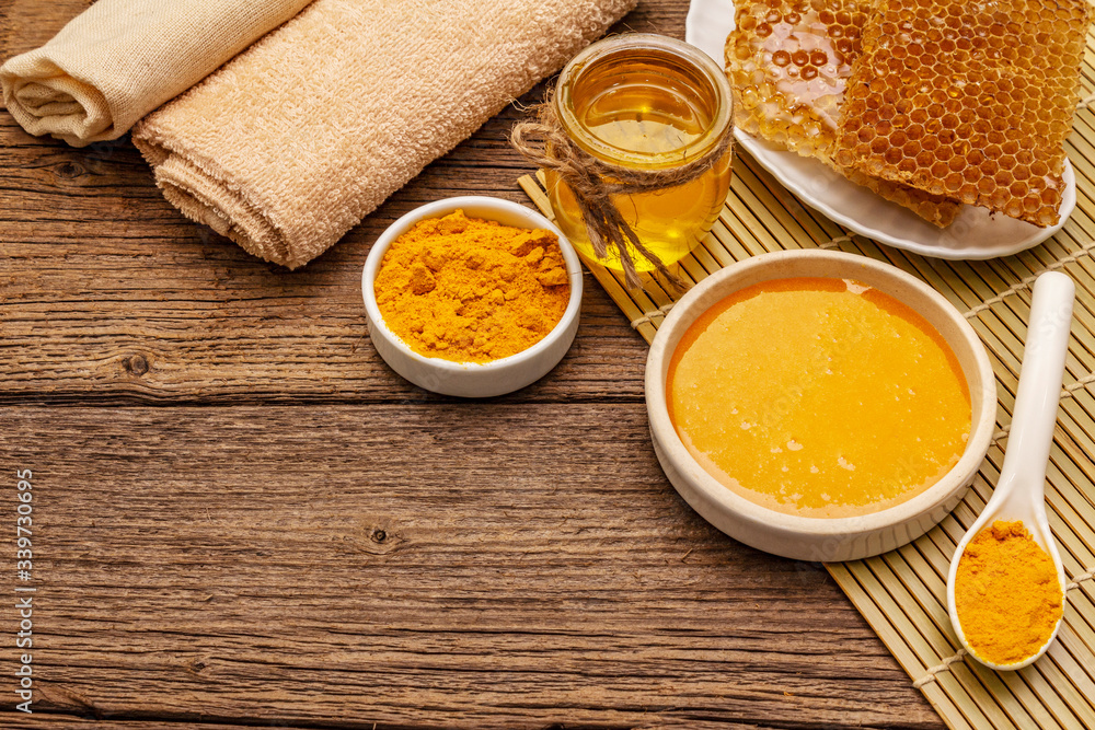 Spa concept. Self care with honey and turmeric. Natural organic cosmetics, homemade product, alternative lifestyle. Vintage background Spa concept. Self care with honey and turmeric. Natural organic cosmetics, homemade product, alternative lifestyle. Vintage background