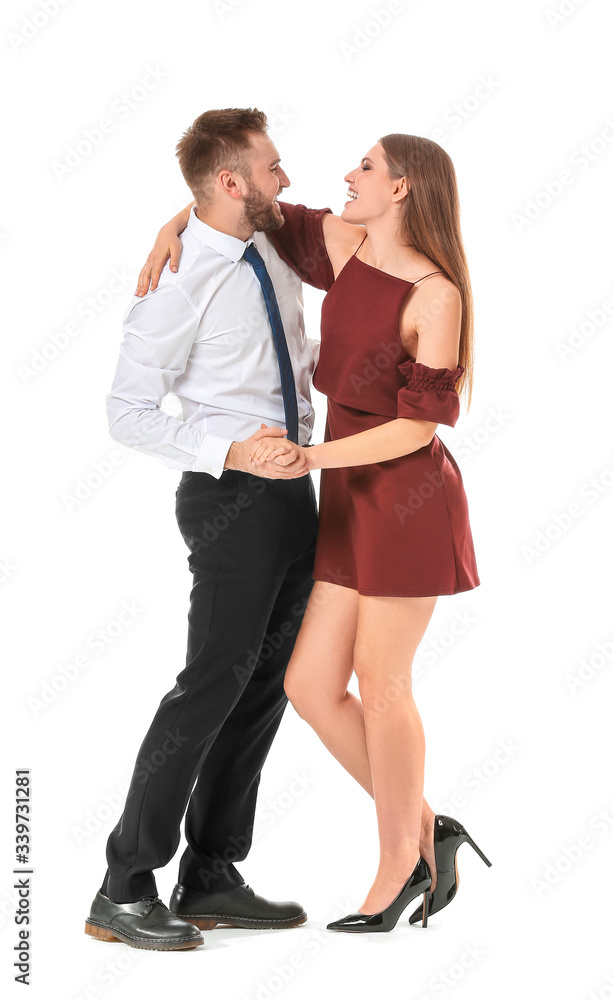 Fototapeta premium Dancing young couple on white background