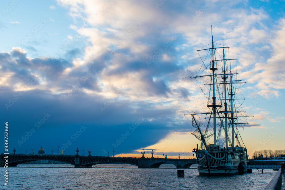 sailing ship in the harbor sunset