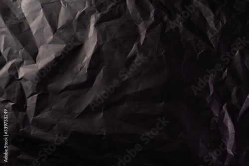 Texture of crumpled black paper. Creative vintage for design background.