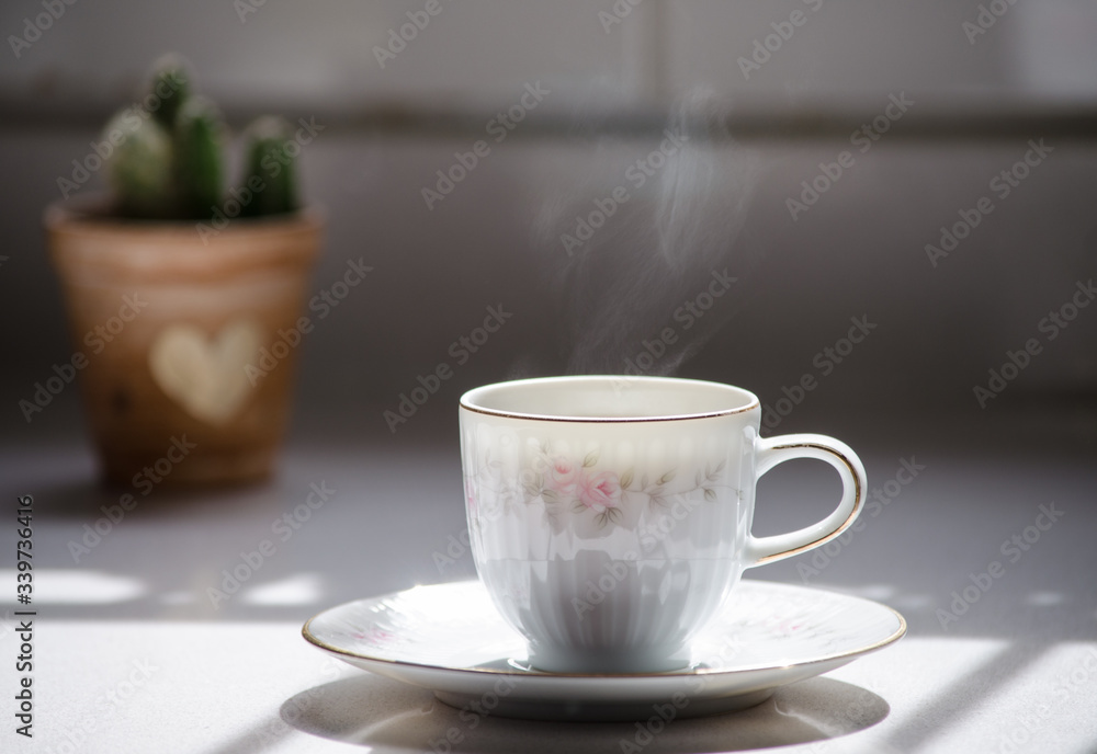 Beautiful porcelain cup of coffee with steam. Beautiful porcelain cup of coffee with steam.