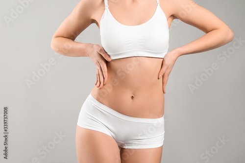 Young woman in underwear on...