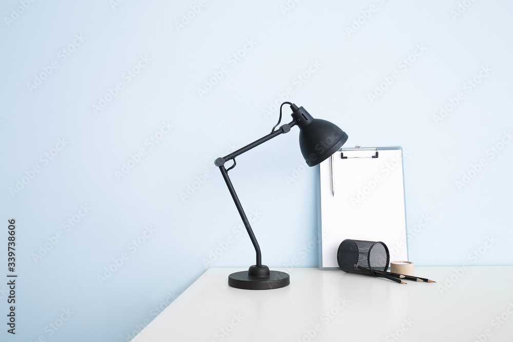 Modern stylish workplace near light wall Modern stylish workplace near light wall