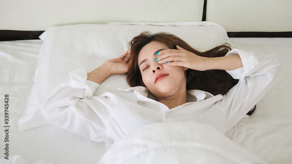 Sleepy woman waking up and rubbing her eyes. Young woman can not sleep. Sleepy woman waking up and rubbing her eyes. Young woman can not sleep.