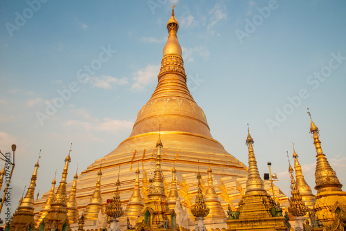 Beautiful view of Shwedagon pagoda is Yangon's most famous landmark in Myanmar at sunset. Shwedagon Pagoda enshrines strands of Buddha's hair and other holy relics. photo