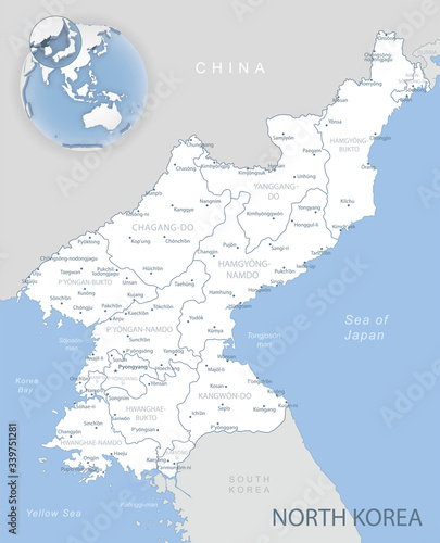 Blue-gray detailed map of North Korea and administrative divisions and location on the globe.