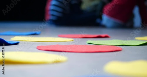 Wallpaper Mural Child stepping on colourful floor fabric spots in play area Torontodigital.ca