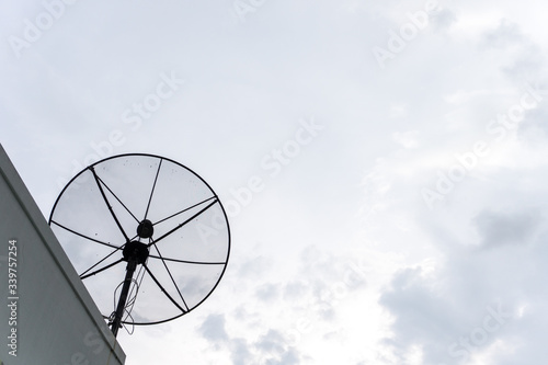 satellite dish antenna on the roof with sky background.