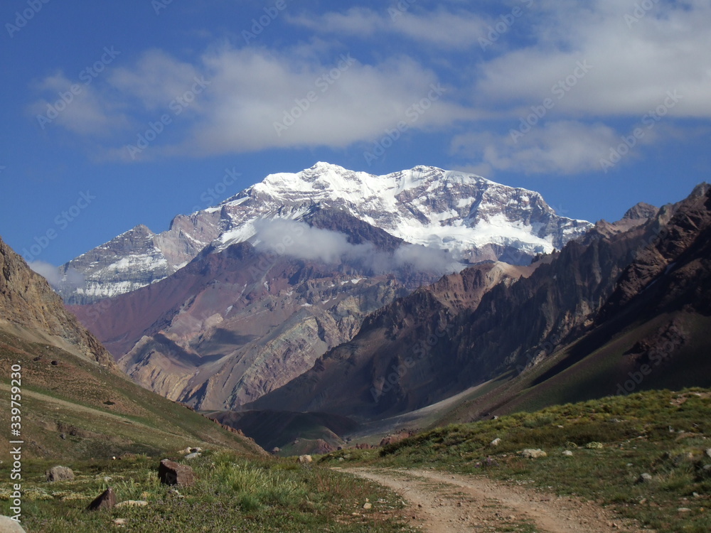 Confluencia Aconcagua Nature surprises us with the contrast between the abundant and and colorful vegetation and the magnificence of the mountain