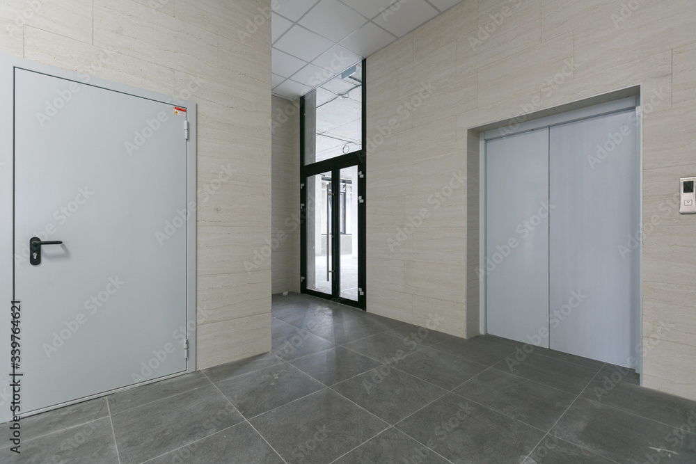 empty pure commercial office building undecorated in gray colors.open space office empty pure commercial office building undecorated in gray colors.open space office