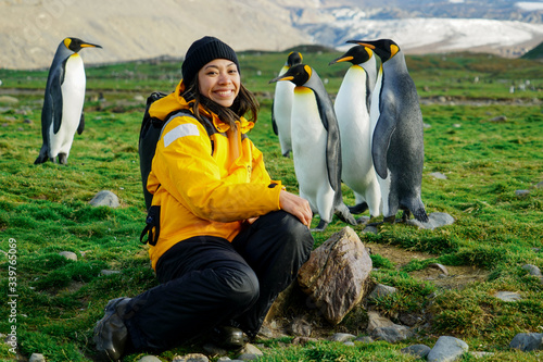 Woman Smiling with Penguins