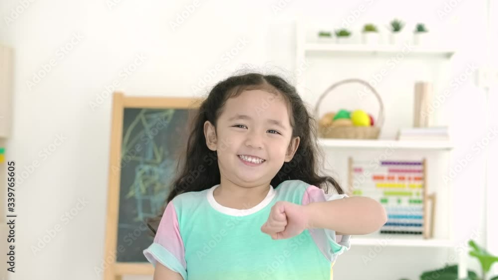 Portrait of happy little girl smile and dancing funny dance in slow motion. Portrait of happy little girl smile and dancing funny dance in slow motion.