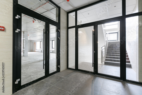 Wallpaper Mural empty pure commercial office building undecorated in gray colors.open space office Torontodigital.ca