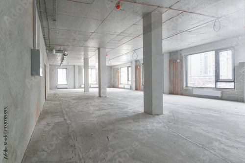 empty pure commercial office building undecorated in gray colors.open space office © gluschenkoart