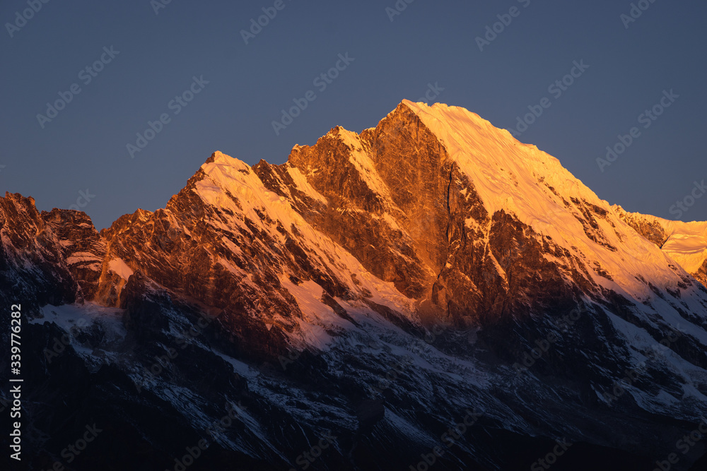 Red snow mountain peak in a morning sunrise, Himalaya mountains range in Everest region, Nepal