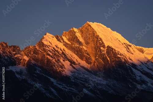 Red snow mountain peak in a morning sunrise, Himalaya mountains range in Everest region, Nepal