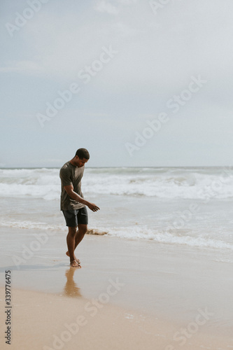 Playful man on the beach