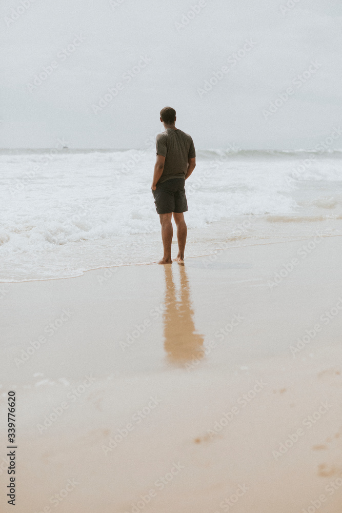 Thoughtful man on the beach