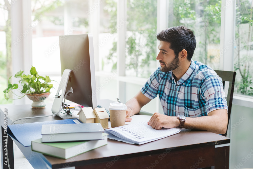 Young business using computer warking in home office. Young business using computer warking in home office.