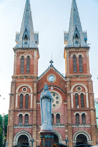 Saigon Notre-Dame Cathedral Basilica (Basilica of Our Lady of The Immaculate Conception) on blue sky background in Ho Chi Minh city, Vietnam. Ho Chi Minh is a popular tourist destination of Asia.