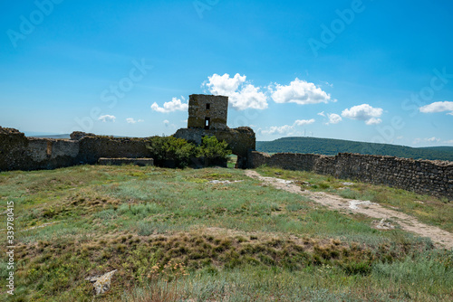medieval fortress with brick walls and defense tower