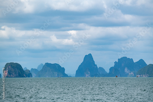 Beautiful landscape of limestone islands and emerald color water in Phang-Nga bay national park near Phuuket Thailand.