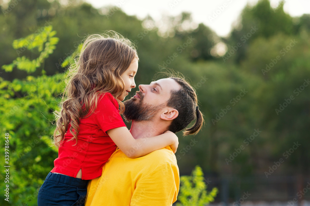 Family portrait. Daughter hugs father. Family fun. Beautiful family together. Leisure together. Smiling daughter. Family holiday concept. Happy childhood. Father day concept. Family portrait. Daughter hugs father. Family fun. Beautiful family together. Leisure together. Smiling daughter. Family holiday concept. Happy childhood. Father day concept.