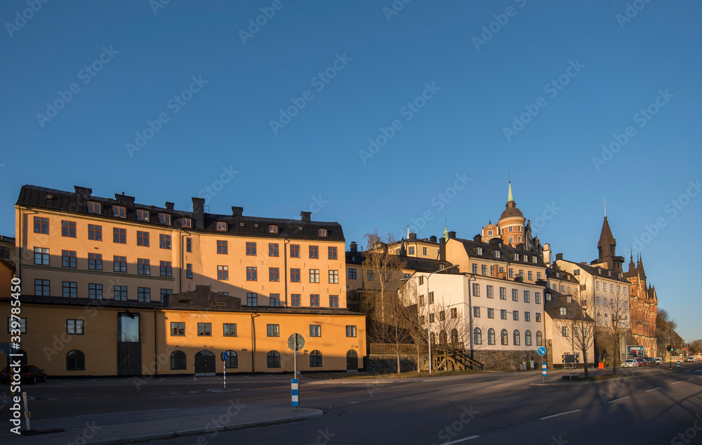 Old part of the district Södermalm with houses on a hill side in Stockholm a sunny morning. 