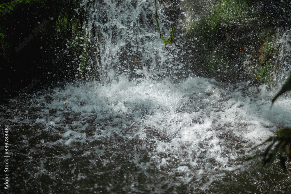 Close up of waterfall dropping into pond Close up of waterfall dropping into pond