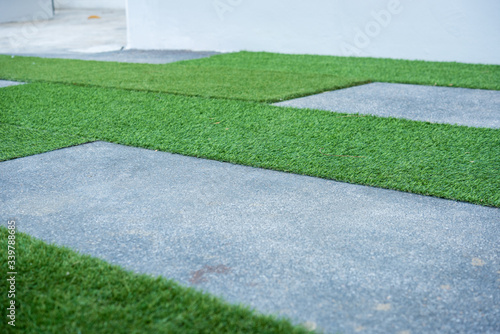 concrete pathway and artificial grass