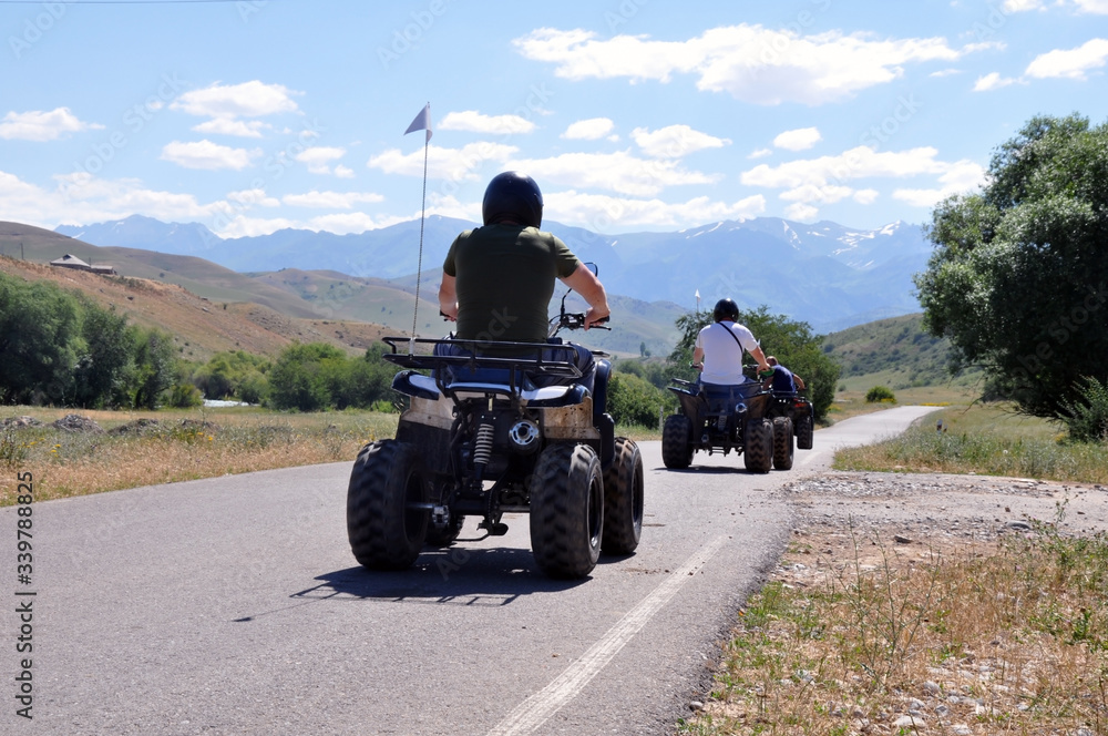 The ATV driving along the road