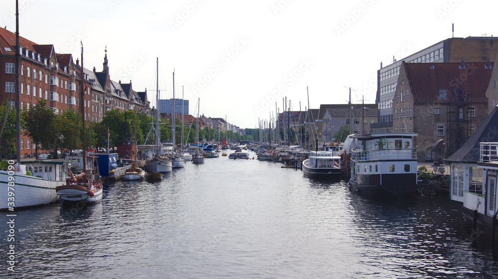 COPENHAGEN, DENMARK - JUL 05th, 2015: Unidentified ships on Christianshavn - canal make a sightseeing by boat through the the city