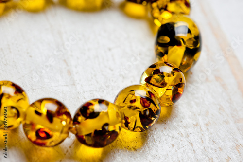 Bright yellow faux amber bracelet and earrings. Background for jewelry and women's jewelry.