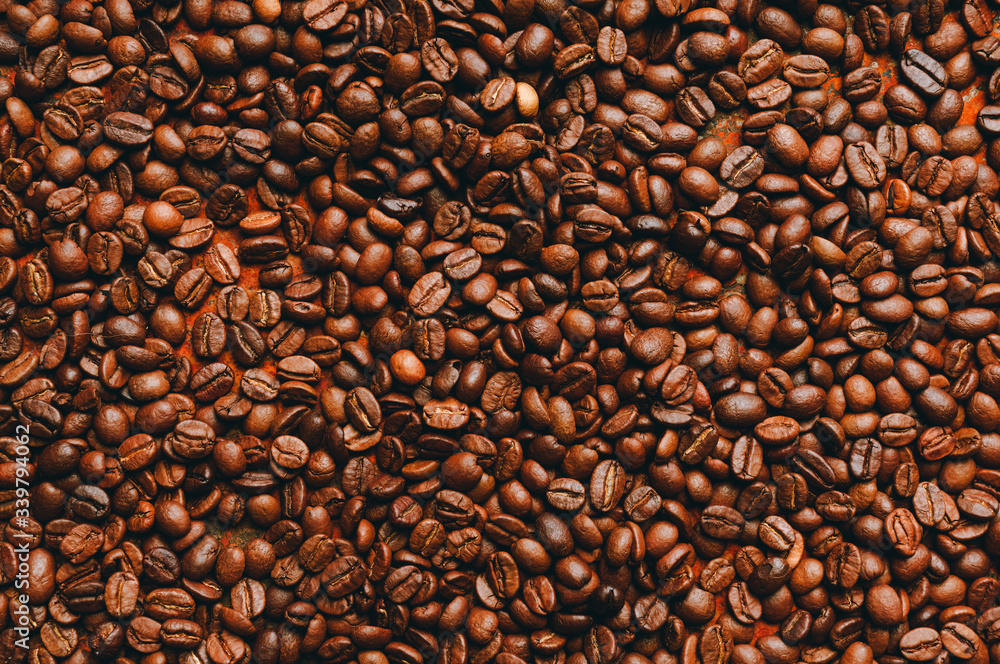 Coffee beans on the rustic background. Selective focus. Shallow depth of field. 