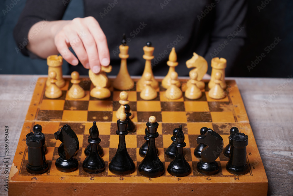Businessman hand moving of playing chess strategyconcept: symbol confident new strategy plan for win and success, sports game thinking battle planning object achievement queen for successful Businessman hand moving of playing chess strategyconcept: symbol confident new strategy plan for win and success, sports game thinking battle planning object achievement queen for successful