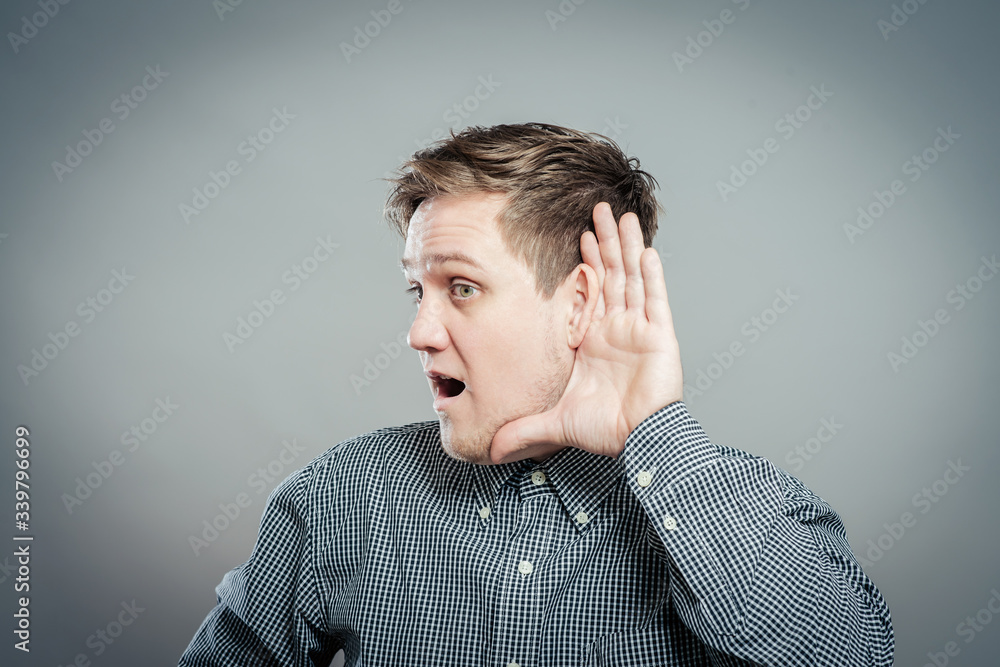 young man which overhears conversation young man which overhears conversation