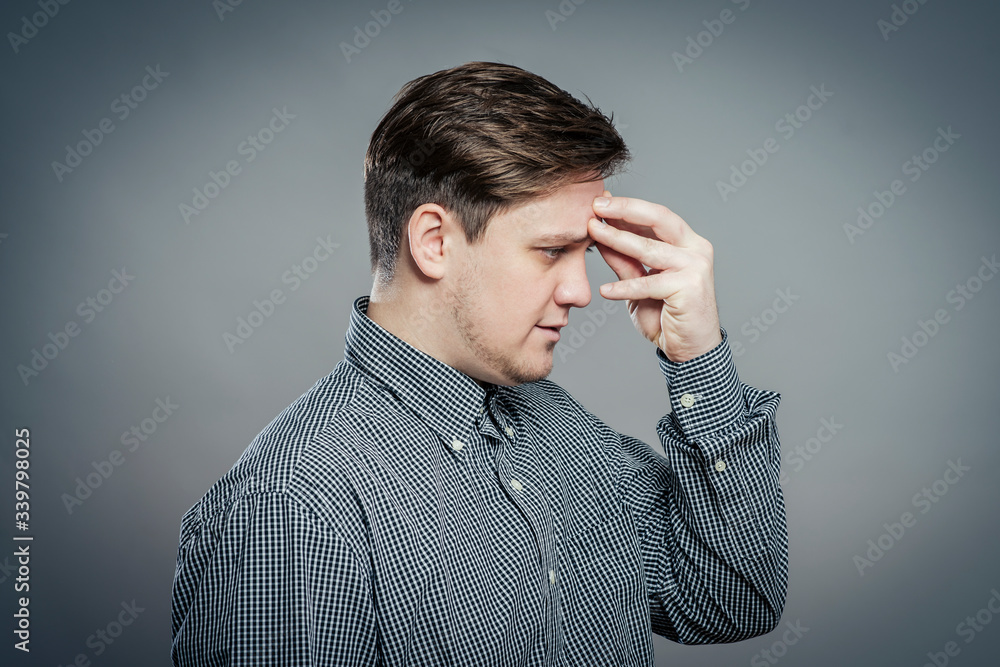 young casual man thinking young casual man thinking