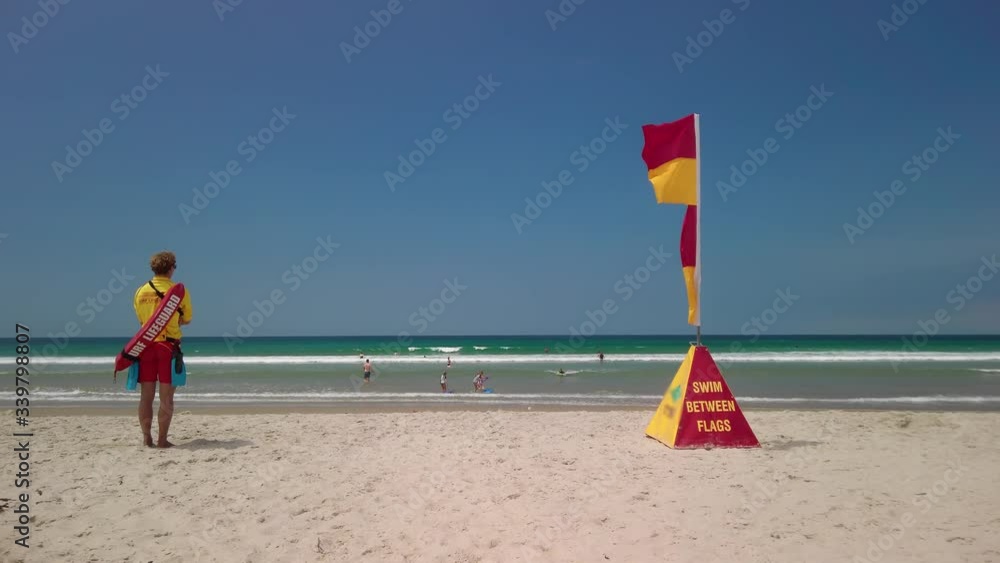 Lifeguard on duty on the beach, New Zealand Lifeguard on duty on the beach, New Zealand